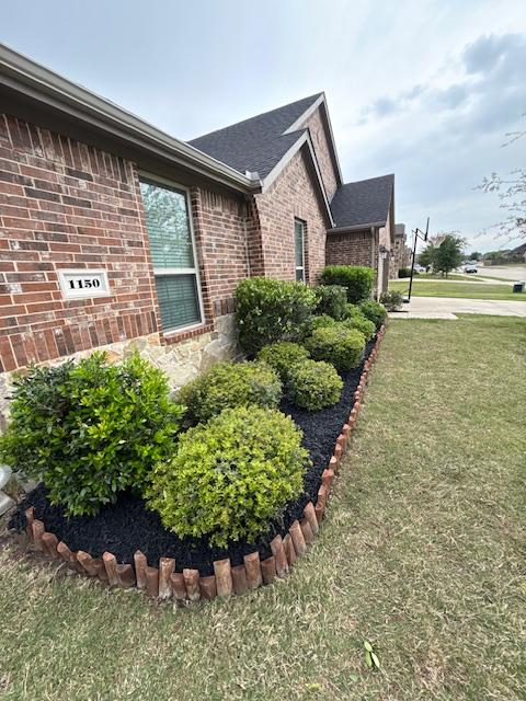 Mulch bed refresh completed by Warrior Landscaping